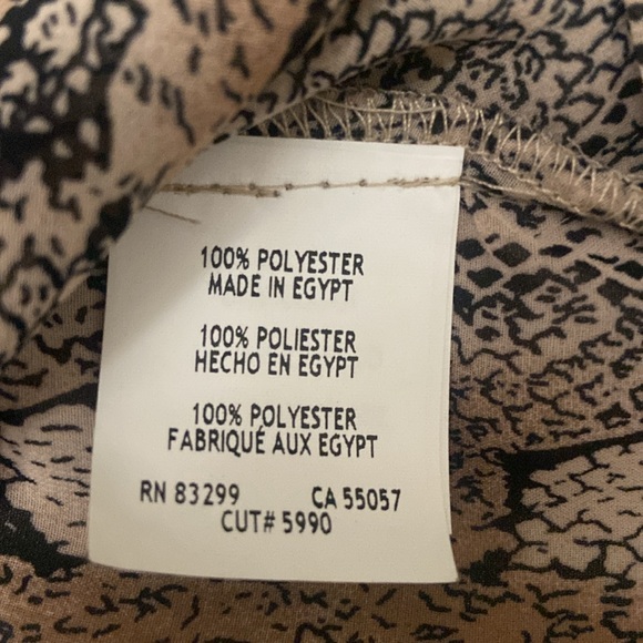 Puffy sleeves,ruffles 1/2 way down front opening. 100% polyester. - Picture 6 of 7